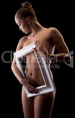 Charming naked girl posing framed her body