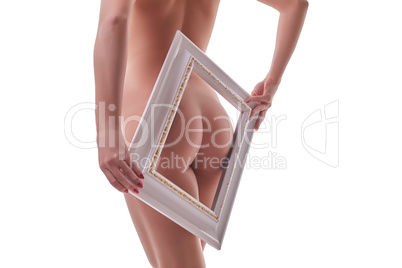 Rear view of slim naked girl framed her ass