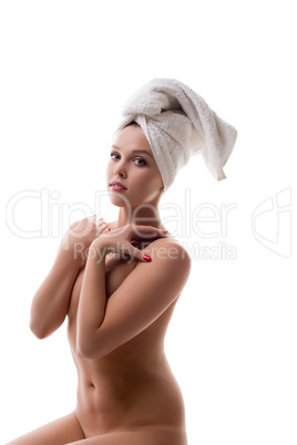 Nude girl with healthy skin posing at camera