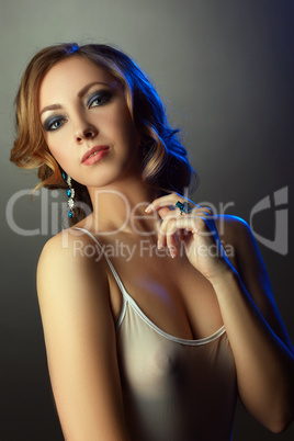 Portrait of seductive model posing in jewelry