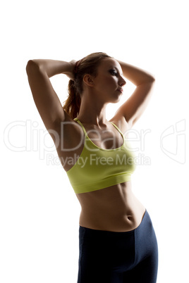Athlete posing with hands clasped behind her head