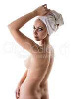 Image of naked woman posing in turning at camera