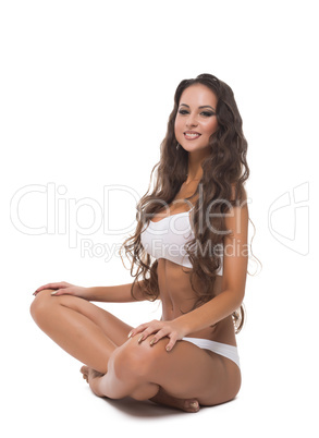 Attractive brunette posing in lotus position