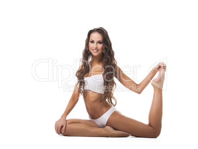Sexy graceful girl posing bent front of camera