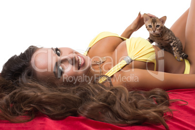 Portrait of beautiful model caresses kitten