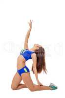 Artistic young sportswoman exercising at camera