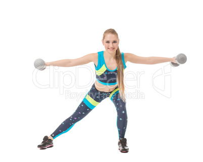 Smiling female athlete exercising with dumbbells