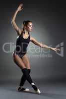 Studio photo of beautiful young ballerina