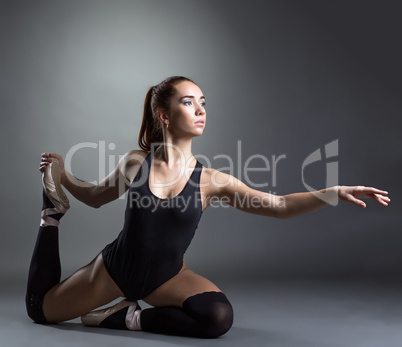 Image of inspired ballerina posing in studio