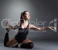 Image of inspired ballerina posing in studio