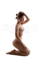 Gorgeous naked girl posing cross-legged