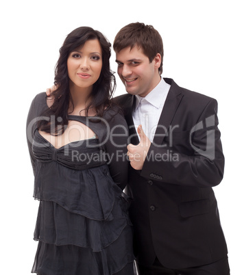 Studio shot of smiling spouses posing at camera