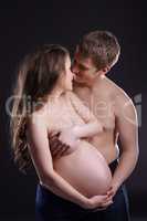 Concept of love and tenderness. Expectant couple