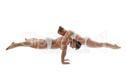 Image of athletes keeping balance in handstand