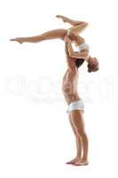 Graceful girl hanging upside down on her partner