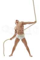 Screaming muscular man posing with rope