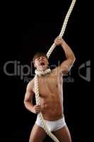 Brawny man strangles himself with rope