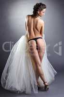 Rear view of seductive undressed bride