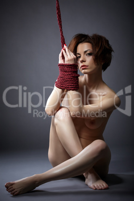 Image of submissive woman posing naked