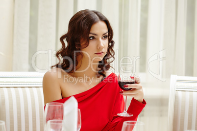 Elegant brunette over dinner in restaurant