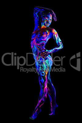 Sexy girl with body art glowing in UV light