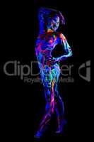 Sexy girl with body art glowing in UV light