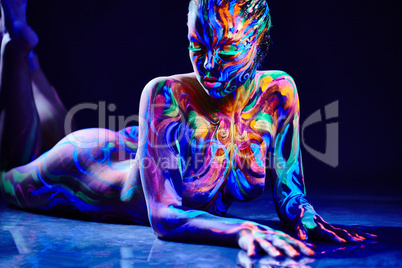 Sensual nude girl with fluorescent body art