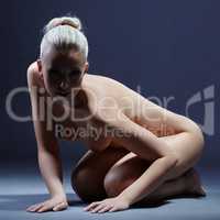 Studio photo of beautiful nude blonde posing