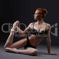 Sexual red-haired ballerina posing in lingerie