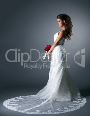 Studio photo of majestic bride in elegant dress