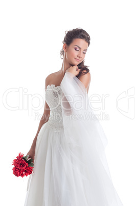 Dreamy bride posing with veil, isolated on white