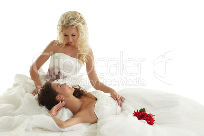 Concept of lesbian wedding. Two alluring brides