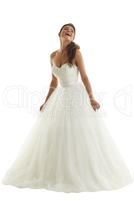 Cheerful bride posing in fashionable wedding dress