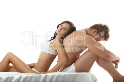 Sexy girl lying on upset guy. Concept of impotence