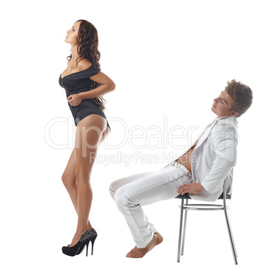 Relaxed man looking at sexy girl dancing