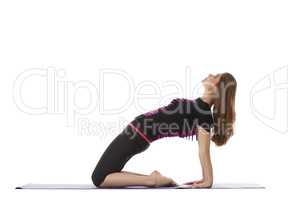 Studio shot of charming woman doing yoga