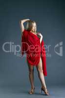Leggy nude dancer posing with red cloth