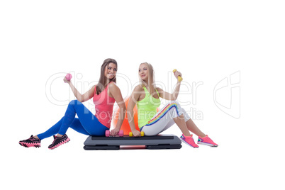 Studio shot of beautiful girls engaged in fitness