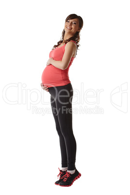 Happy expectant mother warming up at camera