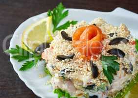 Tasty fish salad decorated with sesame seeds
