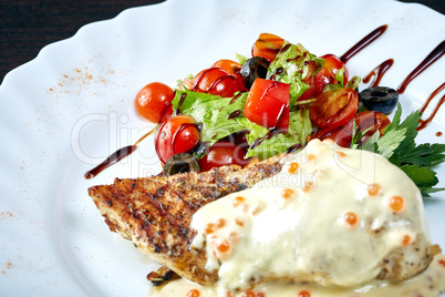 Delicious roasted steak with salad and sauce