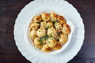 Image of mouthwatering fried dumplings with greens