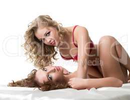 Pretty lesbians posing at camera during foreplay