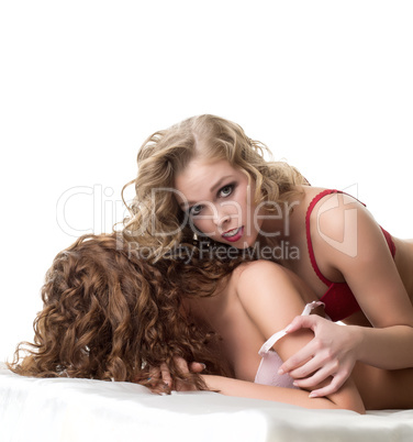 Charming bisexual women posing at camera