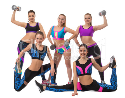 Team of pretty sportswomen posing in studio