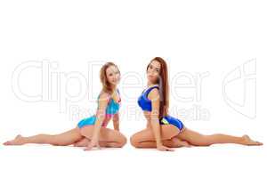 Seductive flexible girls doing stretching exercise