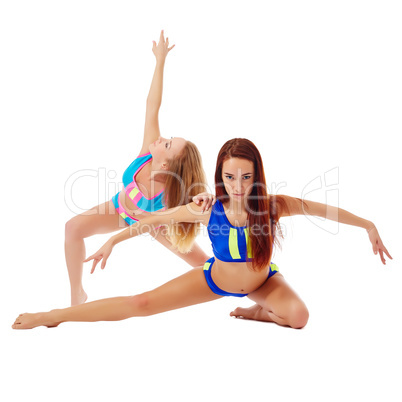 Graceful female athletes posing at camera