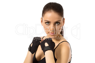 Beautiful female athlete posing in training gloves