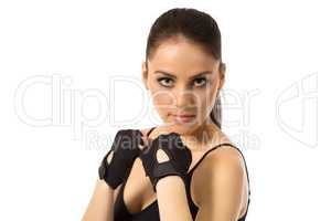 Beautiful female athlete posing in training gloves