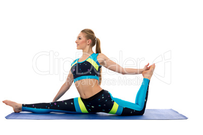 Beautiful slim girl doing stretching exercises